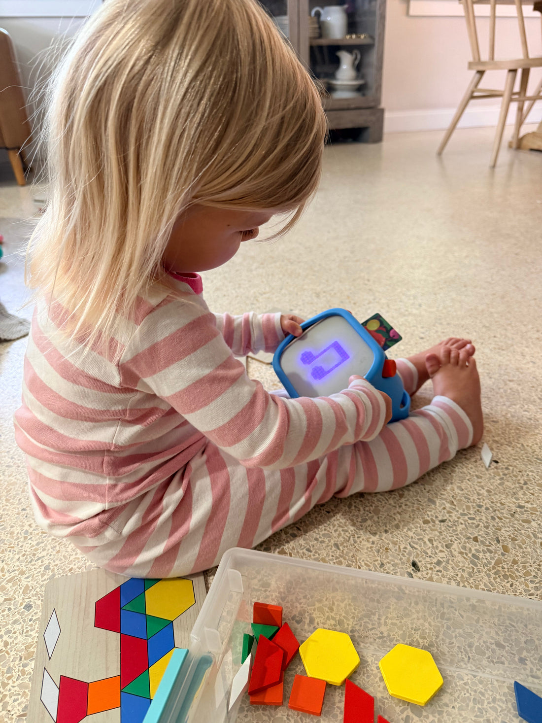 Young girl listening to audio Bible stories on a Yoto Player, showing how kids can hear God's Word during everyday routines.
